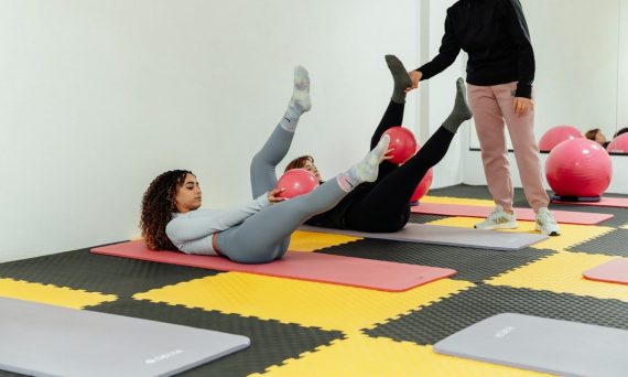 a group of people doing exercises in a gym